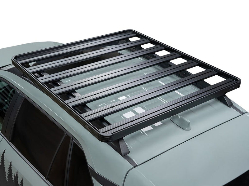 Load image into Gallery viewer, Front Runner Slimline II Roof Rack Kit installed on a Toyota RAV4 Adventure / TRD-Offroad 2019, showing a close-up view of the sleek black rack on a silver vehicle.
