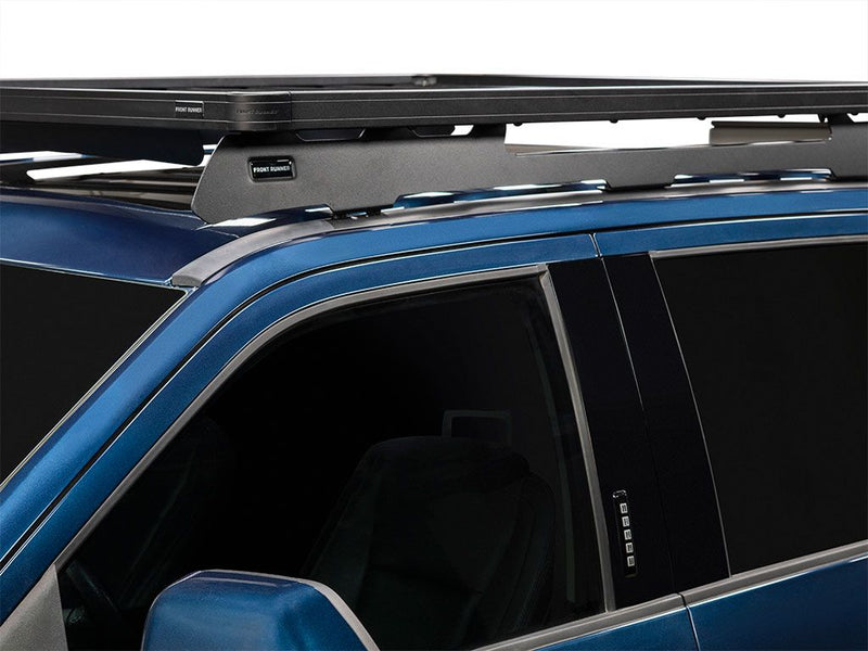 Load image into Gallery viewer, Front Runner Slimline II Roof Rack Kit installed on blue Ford F250 Super Duty Crew Cab showing tall profile and secure fit.
