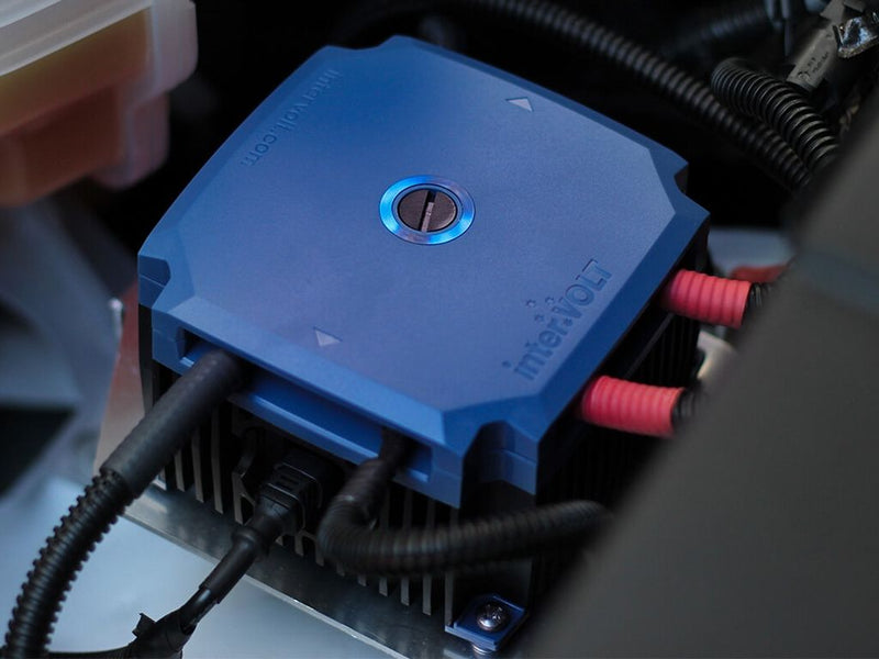 Load image into Gallery viewer, Front Runner Intervolt DCC Pro In-Vehicle DC-DC Battery Charger installed in a vehicle with visible electrical connections

