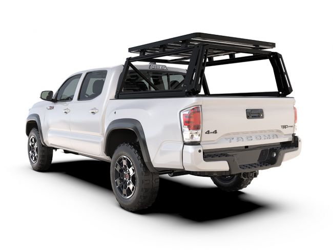 Alt text: inchWhite Toyota Tacoma Double Cab with Front Runner Pro Bed Rack Kit installed, showing off-road utility and sleek design.inch