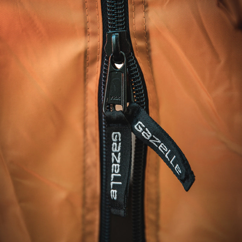 Load image into Gallery viewer, Close-up view of Gazelle Tents T8 Hub Tent zipper and branded pull tab.
