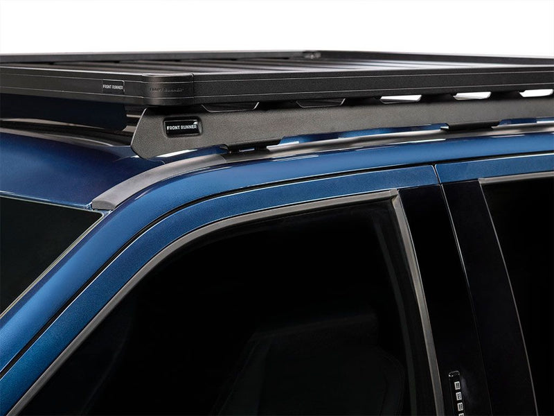 Load image into Gallery viewer, Front Runner Slimline II Low Profile Roof Rack Kit installed on a blue Ford F250 Crew Cab, years 1999-2016, side view.
