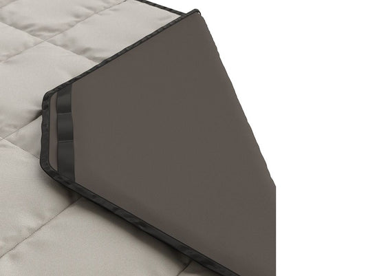 "Close-up of ash-colored Front Runner Dometic Go Camp Blanket with detailed stitching and durable edge lining"