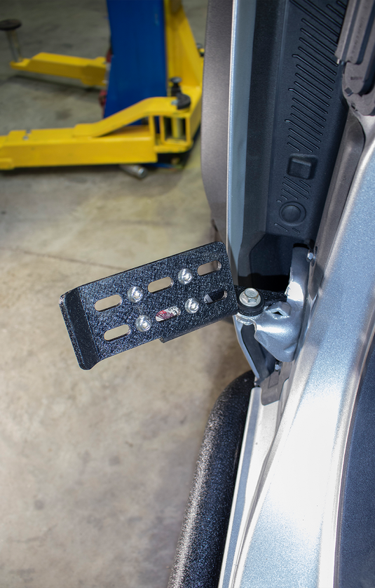 alt="Fishbone Offroad foot peg set installed on 2022 Ford Bronco door, exterior accessory view"