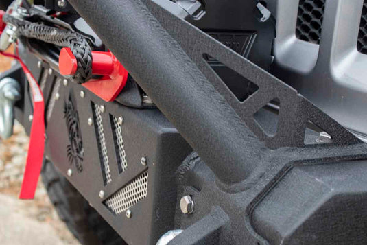 Alt text: "Close-up of a Fishbone Offroad Barracuda Modular Bumper on a Jeep Wrangler, featuring textured surfaces and integrated winch mount."