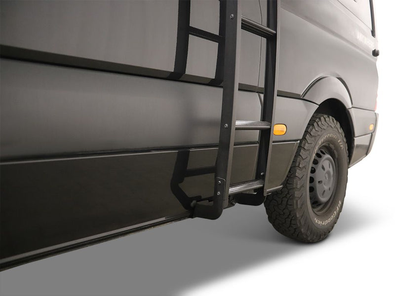 Load image into Gallery viewer, Alt text: &quot;Front Runner Mercedes-Benz Sprinter H1 Slimpro Van Rack Ladder attached to the side of a gray van, showing a sturdy step for roof access.&quot;
