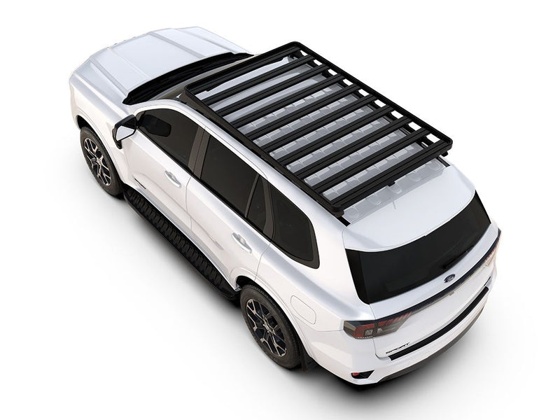 Load image into Gallery viewer, Alt Text: &quot;White Ford Everest 2022 with Slimline II Roof Rack Kit by Front Runner mounted on top, viewed from a high angle.&quot;
