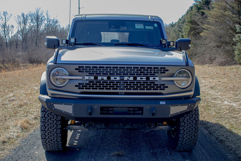 Load image into Gallery viewer, Alt text: &quot;2022 Ford Bronco equipped with Fishbone Offroad Steelhead Front Bumper, showcasing rugged design and durability, parked outdoors.&quot;
