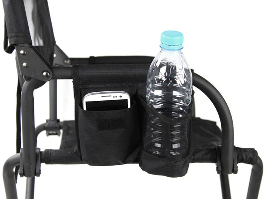 Close-up of the Front Runner Expander Camping Chair showing a water bottle and smartphone in the side storage pockets.