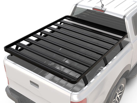 Front Runner Slimline II load bed rack kit installed on a white Dodge Ram Mega Cab 4-door pickup truck, 2009-current model, suitable for cargo management and outdoor gear.