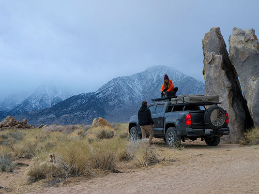 Chevrolet Colorado pickup truck equipped with Front Runner Slimline II Load Bed Rack Kit in a rugged outdoor setting