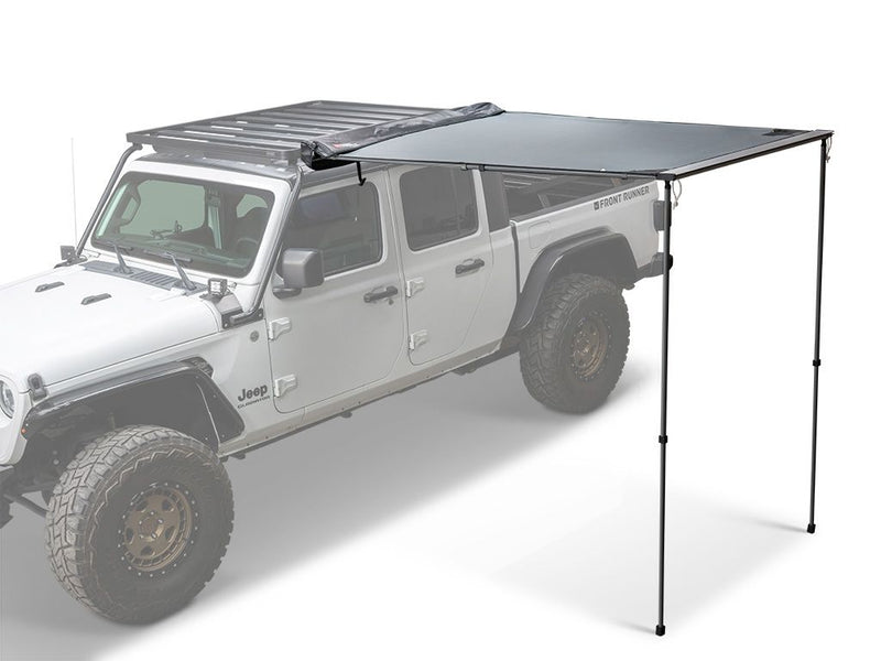 Load image into Gallery viewer, Front Runner Easy-Out Awning - 1.4M attached to white Jeep with roof rack, providing shade for outdoor adventures.
