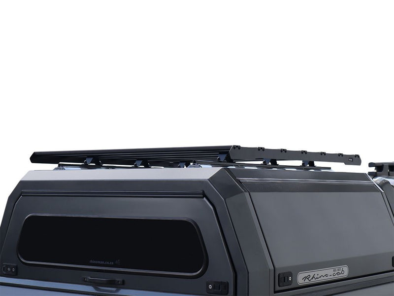 Load image into Gallery viewer, Front Runner Slimsport Rack Kit mounted on 5.5 foot pickup truck bed canopy, low-profile roof rack design, vehicle cargo storage solution.
