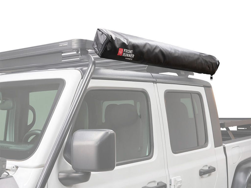 Load image into Gallery viewer, Front Runner Easy-Out Awning 1.4M mounted on vehicle roof rack for outdoor adventure
