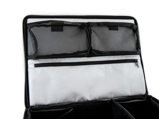Alt text: "Front Runner Flat Pack open organizer with mesh pockets and zipper compartment, travel storage solution."