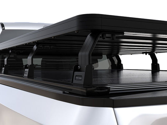 Close-up view of Front Runner Ford F-150 Retrax XR 6'6 Slimline II Load Bed Rack installed on pickup truck bed.