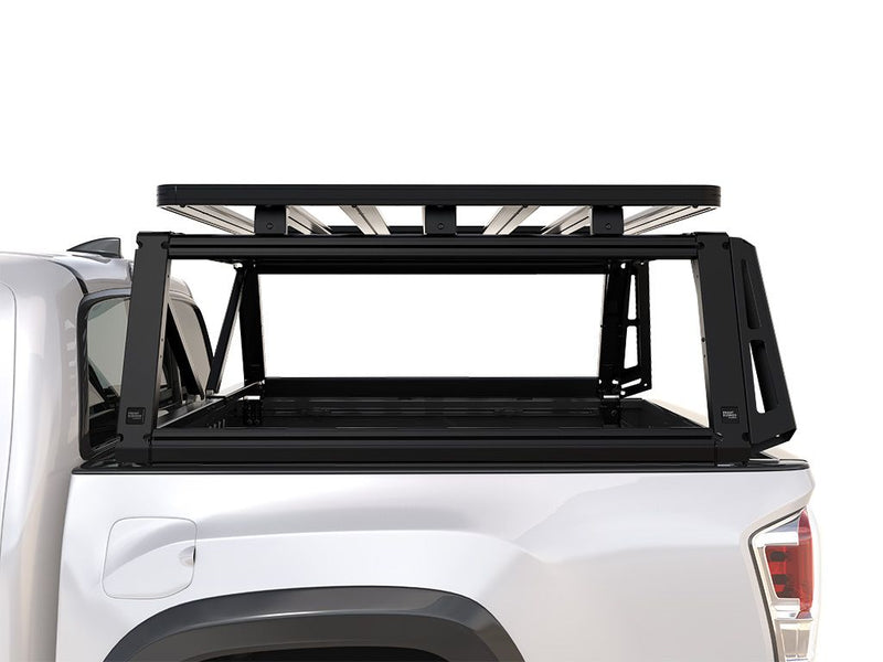 Load image into Gallery viewer, Front Runner Pro Bed Rack Kit installed on Toyota Tacoma Double Cab showing the sturdy frame and cargo management system.
