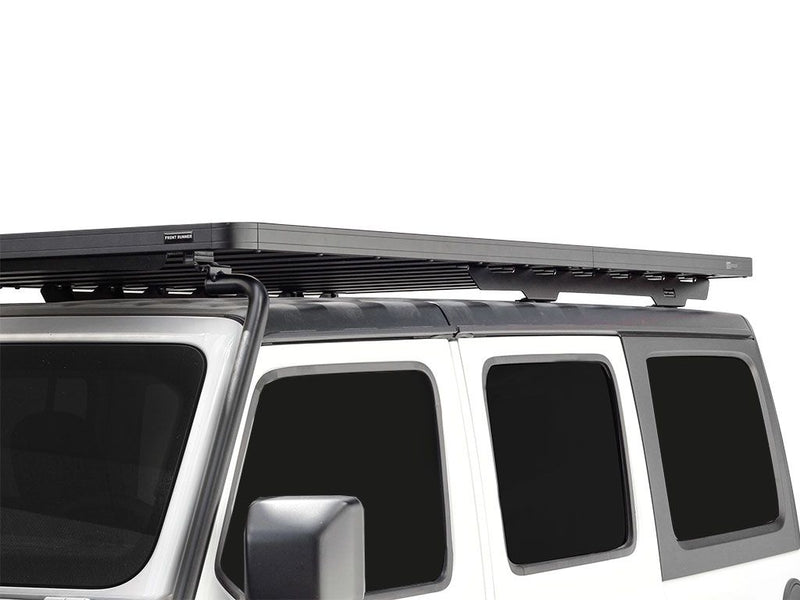 Load image into Gallery viewer, Front Runner Extreme Roof Rack Kit installed on a 2018 Jeep Wrangler JL 4 Door, showcasing the sleek design and durability.
