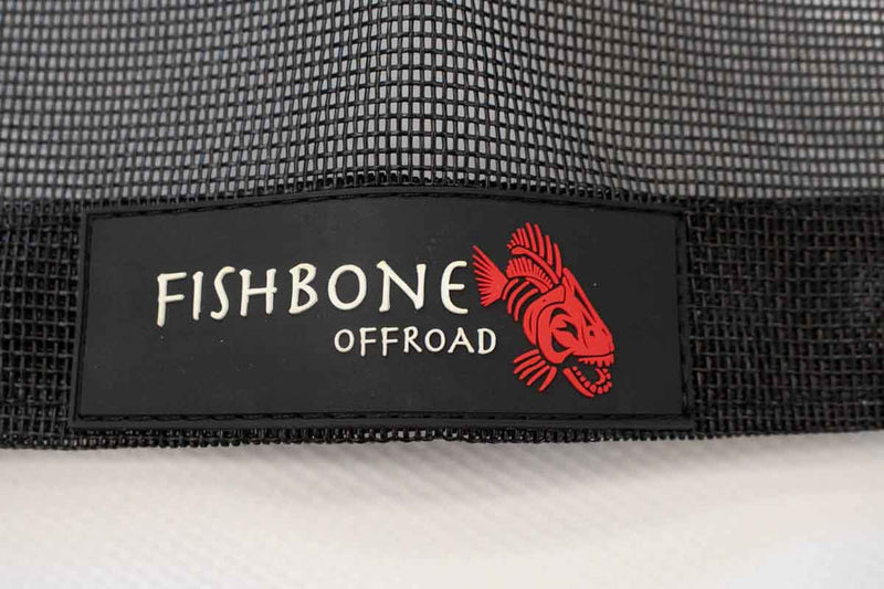 Load image into Gallery viewer, Alt text: &quot;Close-up of Fishbone Offroad logo on a black mesh Jeep Wrangler JLU Full Sun Shade for 2018-current models.&quot;
