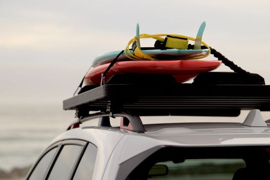 Front Runner Jeep Cherokee KL Slimline II roof rack with kayaks attached, suitable for 2014 to current models, showcasing storage capabilities and adventure readiness.