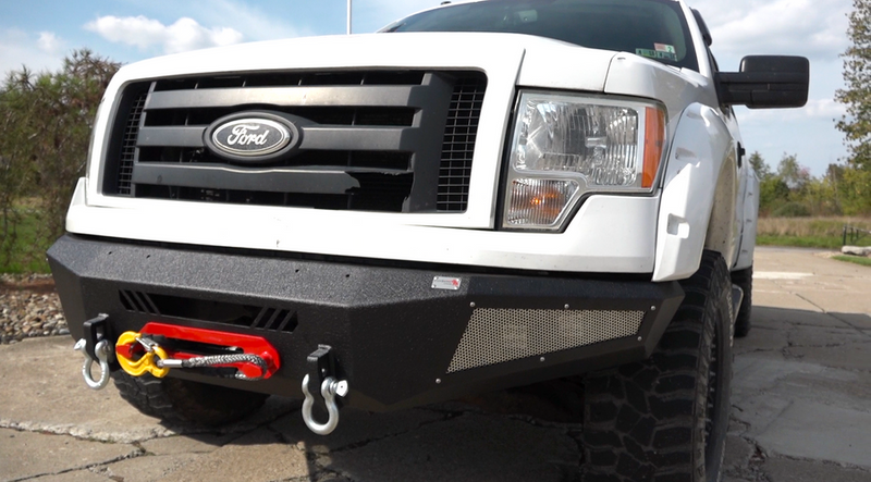 Load image into Gallery viewer, Alt text: &quot;Fishbone Offroad Pelican Front Bumper on 2009-2014 Ford F-150 with tow hooks and LED light bars&quot;
