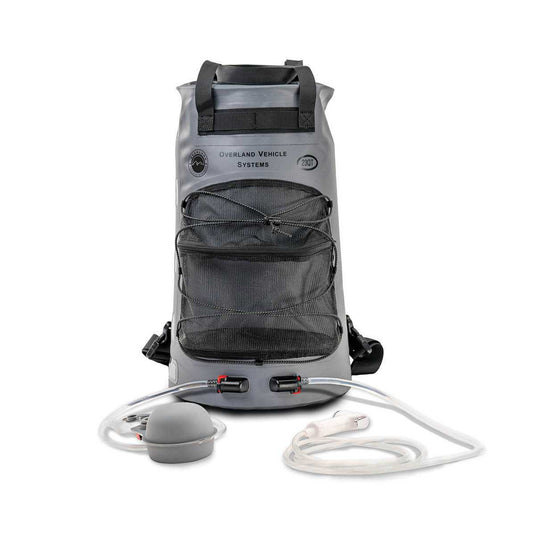 Alt text: "Overland Vehicle Systems portable camp shower with 23 QT capacity featuring hose, nozzle, and storage compartments on white background."