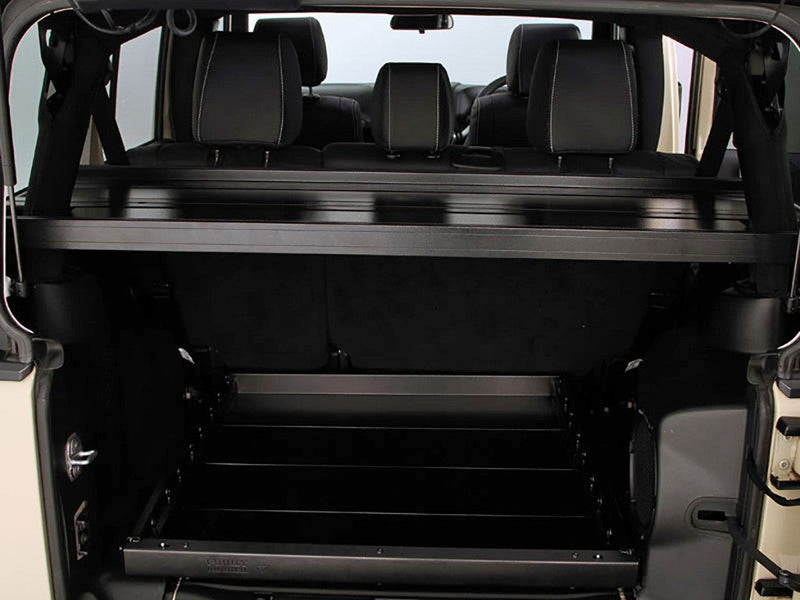 Load image into Gallery viewer, Front Runner Jeep Wrangler JKU 4-Door Cargo Storage Interior Rack installed in vehicle, showing spacious multi-tier shelving for organization.
