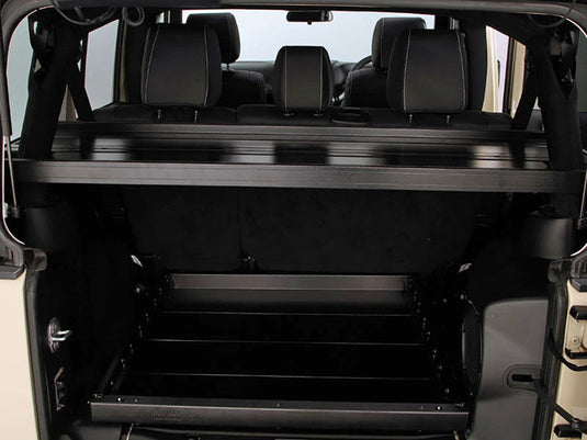 Front Runner Jeep Wrangler JKU 4-Door Cargo Storage Interior Rack installed in vehicle, showing spacious multi-tier shelving for organization.