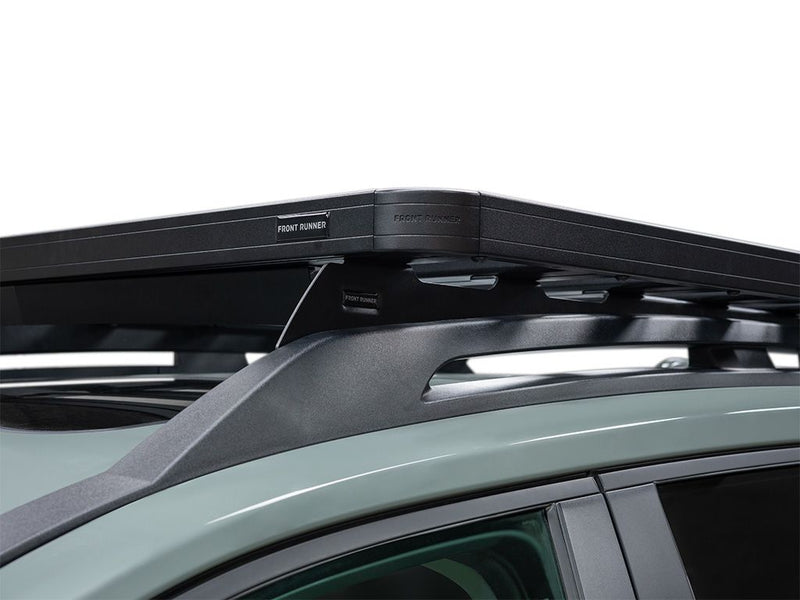 Load image into Gallery viewer, Close-up of the Front Runner Slimline II Roof Rack Kit installed on a Toyota RAV4 Adventure/TRD-Offroad, showcasing the sturdy black structure and sleek design.
