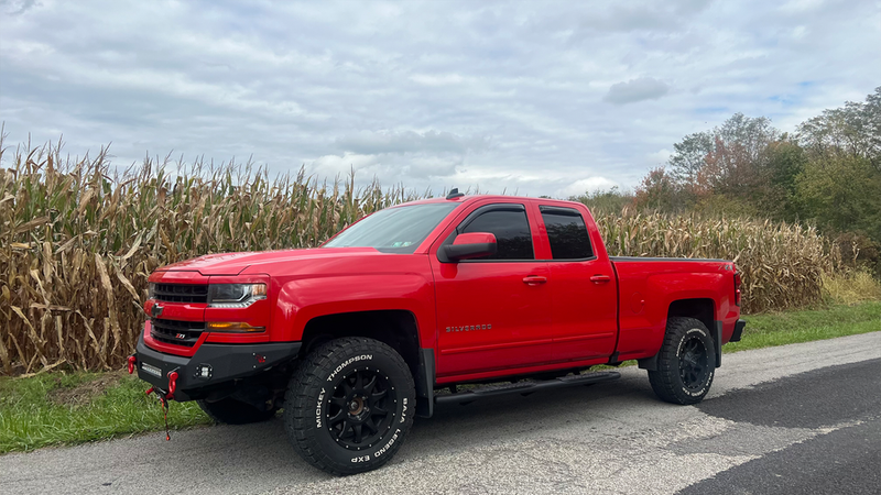 Load image into Gallery viewer, Red 2014-2019 Chevrolet Silverado Double Cab Pickup with Fishbone Offroad 5-inch Oval Side Steps_installed.
