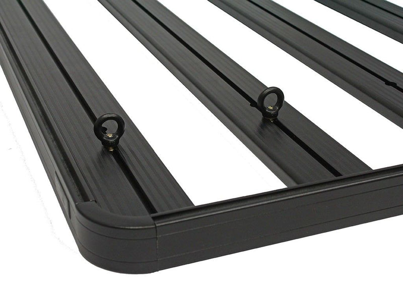 Load image into Gallery viewer, Close-up of black Front Runner tie down rings installed on a vehicle rack, designed for securing cargo.
