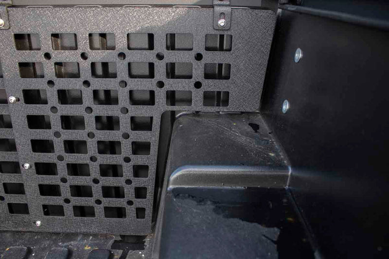 Load image into Gallery viewer, Alt text: &quot;Installation view of the Fishbone Offroad Molle Panel on a 2016-2023 Toyota Tacoma bed front wall, with square-cut pattern for organization and attachment of accessories.&quot;
