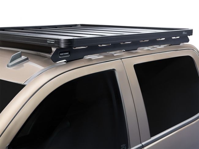 Load image into Gallery viewer, Front Runner Slimline II roof rack kit installed on a beige Chevrolet Silverado/GMC Sierra 1500 Crew Cab, model years 2014-2018, showcasing the sleek design and durable build quality.
