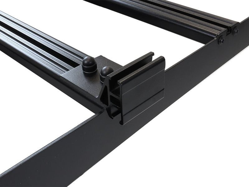 Load image into Gallery viewer, Front Runner Slimsport Side Mount Accessory Bracket small size for vehicle rack systems, showing the durable black metal construction and the mounting mechanism detail.
