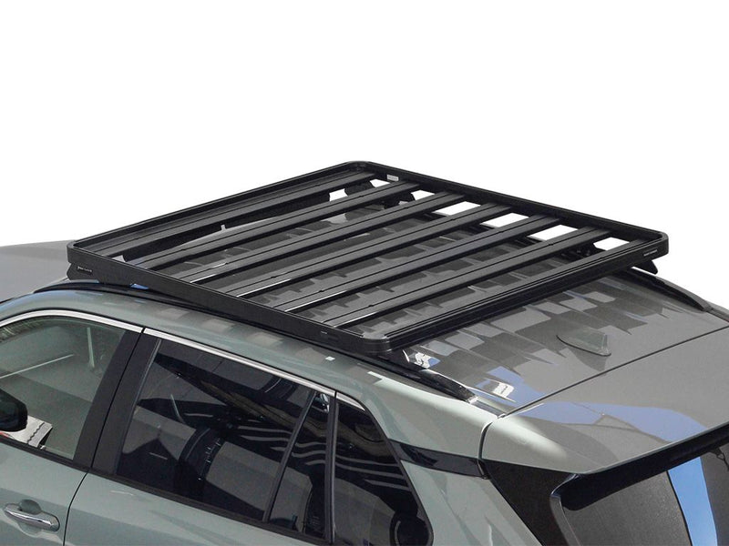 Load image into Gallery viewer, Front Runner Toyota RAV4 2019 Slimline II Roof Rack Kit installed on a vehicle, offering sturdy cargo support.
