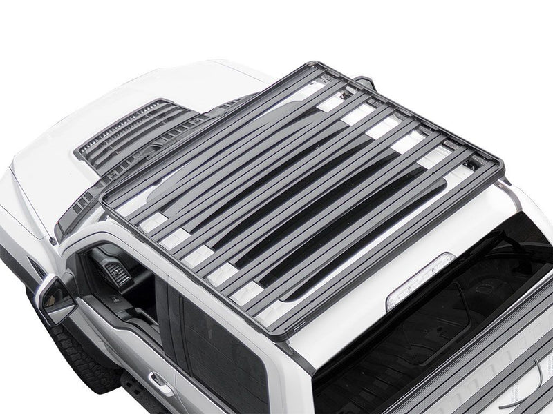 Load image into Gallery viewer, Front Runner Ford F150 Raptor 2009-Current Slimline II Roof Rack Kit installed on white truck, low profile design, top view.
