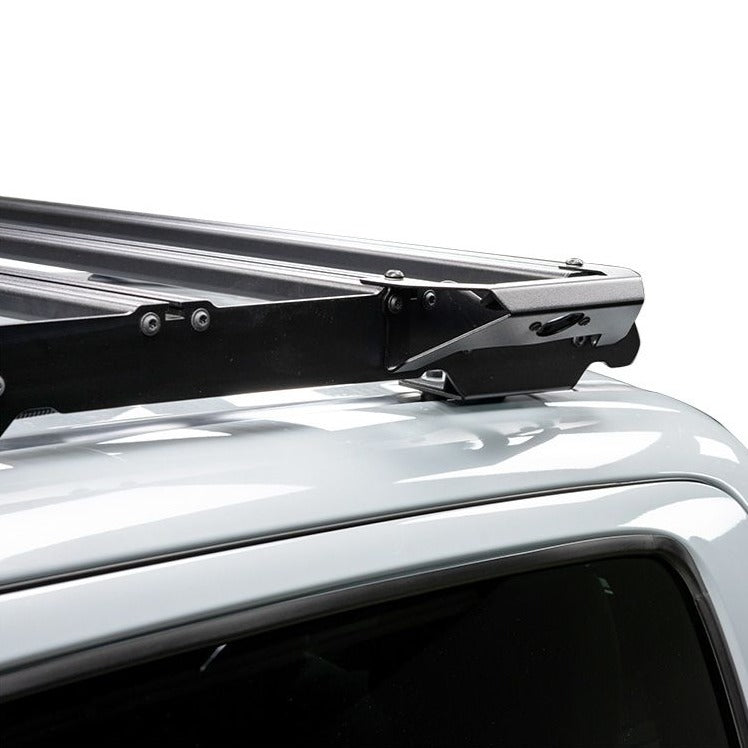 Load image into Gallery viewer, Close-up of Front Runner Handle Light Slimsport Rack Bracket attached to vehicle roof
