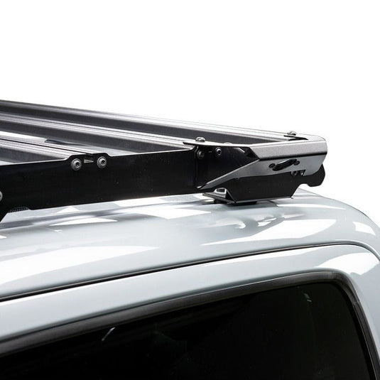 Close-up of Front Runner Handle Light Slimsport Rack Bracket attached to vehicle roof