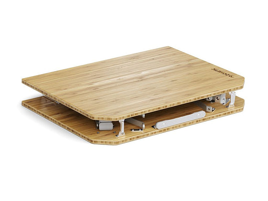 Alt text: "Front Runner Dometic Go Compact Camp Table made with bamboo, showcasing its foldable metal legs and portable design for outdoor activities."