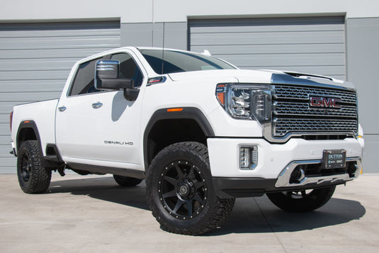 White GMC truck equipped with ICON Vehicle Dynamics Rebound wheels in Satin Black finish.