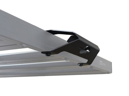 Alt text: inchClose-up of a Front Runner Rack Handle Bracket attached to a vehicle roof rack, showcasing its durable design and easy-grip handle.inch