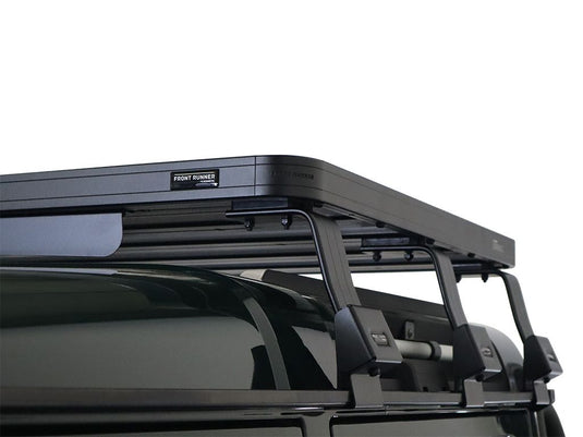 Alt text: "Front Runner Ineos Grenadier Quartermaster (2023-Current) Slimline II half roof rack kit installed on SUV"