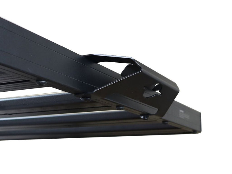 Load image into Gallery viewer, Close-up of a black Front Runner Rack Handle Bracket attached to a vehicle roof rack.
