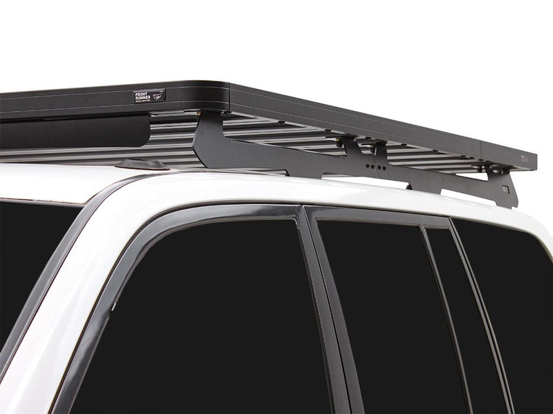 Load image into Gallery viewer, Front Runner Slimline II roof rack on Toyota 100 Series Land Cruiser / Lexus LX470, durable off-road vehicle gear storage system.
