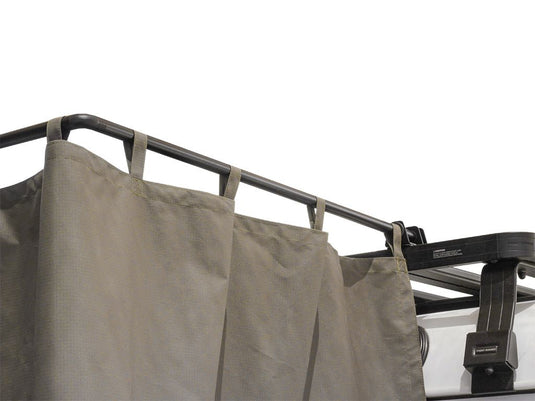 Front Runner Rack Mount Shower Cubicle attached to a vehicle roof rack, featuring a grey privacy curtain.