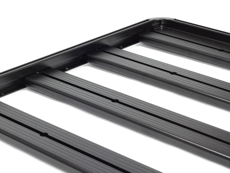 Load image into Gallery viewer, Close-up of black Front Runner Slimline II Roof Rack Kit for Chevrolet Colorado 2015-Current, showcasing sturdy construction and aerodynamic design.
