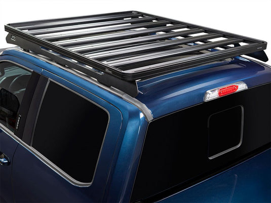 Front Runner Slimline II roof rack kit installed on a blue Ford F250 Super Duty Crew Cab, model year 1999 to current, showing the tall configuration for increased cargo space.