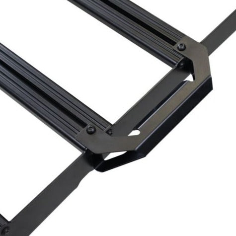 Close-up view of the Front Runner Handle/Light Slimsport Rack Bracket installed on a rack, showcasing its mounting points and durable construction.