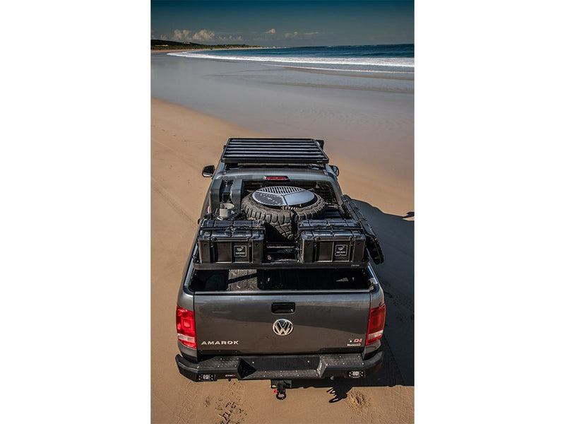 Load image into Gallery viewer, Front Runner Ram 1500 Load Bed Rack on Volkswagen Amarok pickup parked on a sandy beach
