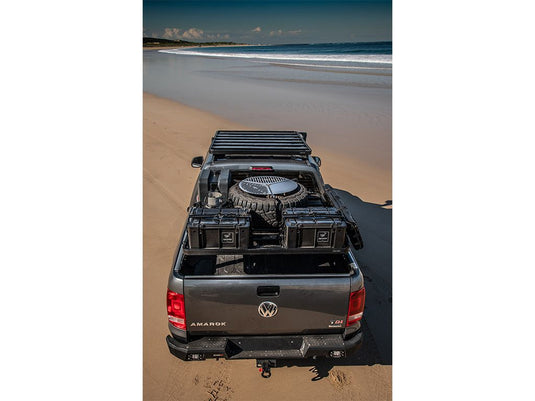 Front Runner Ram 1500 Load Bed Rack on Volkswagen Amarok pickup parked on a sandy beach